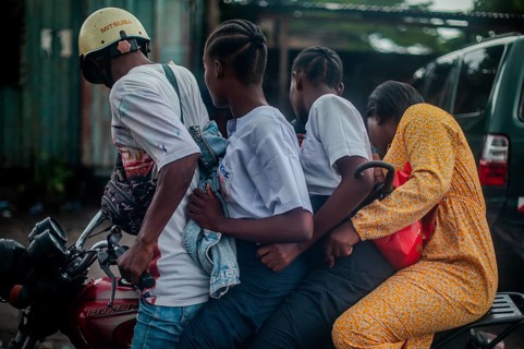 Four on a motorbike, everyday life in Kinshasa, Democratic Republic of the Congo, DR Congo