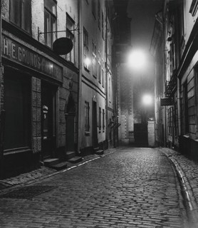In the 1950s. An evening view of a street with old houses