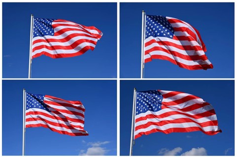 Closeup of the national flag of the United States fluttering in the wind on a sunny day