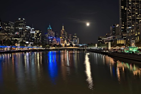 The skyline of Melbourne and the Yarra river at nighttime when there was an event of supermoon
