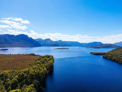 Lake Burbury and surrounding mountain landscape on a warm summer's aftenoon near Queenstown in