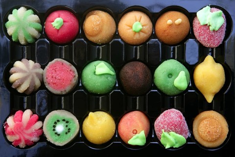 Colorful marzipan sweets with fruits shapes made of almond and sugar