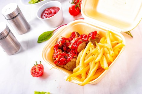 Grilled bratwurst with French fries and ketchup