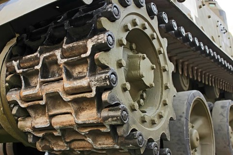 Part of the undercarriage of tracked military equipment, close-up