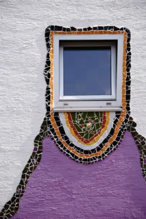The close-up of a window which was decorated all around with glass splinters