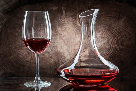 Wineglasss And Decanter With Red Wine On Vintage Wood Background