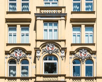 Munich, Bavaria - Germany - 07 29 2018 Detail of a historical yellow facade with ornaments