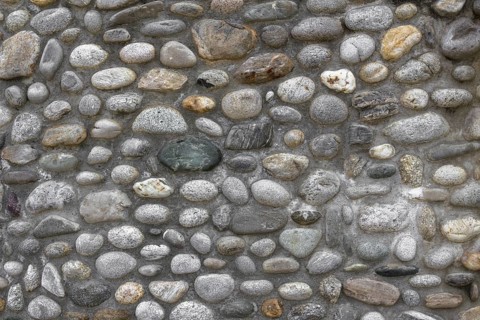 Front view of a wall of stones with cut irregular