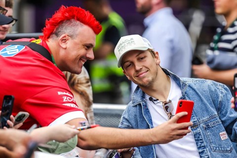 MELBOURNE, AUSTRALIA - MARCH 13: Liam Lawson of New Zealand and Oracle Red Bull Racing with fans