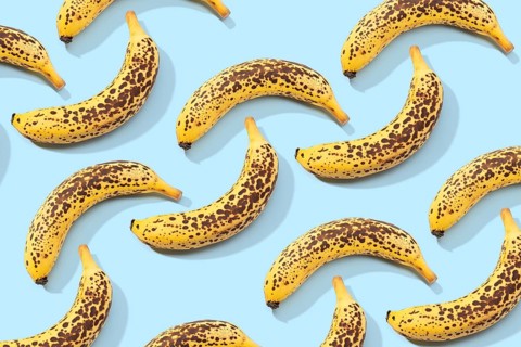 Spotted Banana pattern on blue background. Art food