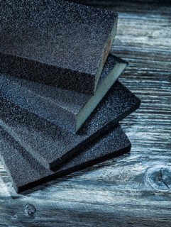 Polishing sanding blocks on vintage wooden board
