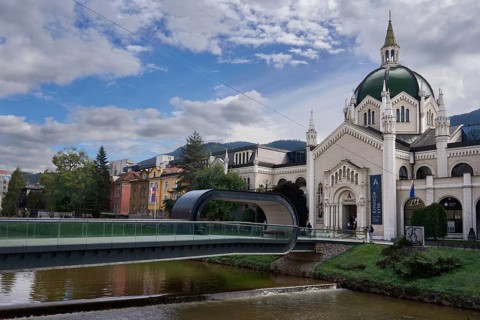 Festina Lente Bridge, pedestrian bridge over the Miljacka River, bridge with a loop, on the right