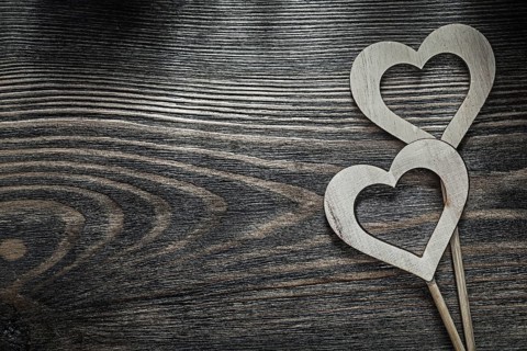 White wooden hearts on wood board holidays concept