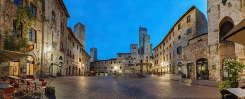 Panoramic view of famous Piazza della Cisterna in the historic town of San Gimignano on a morning,