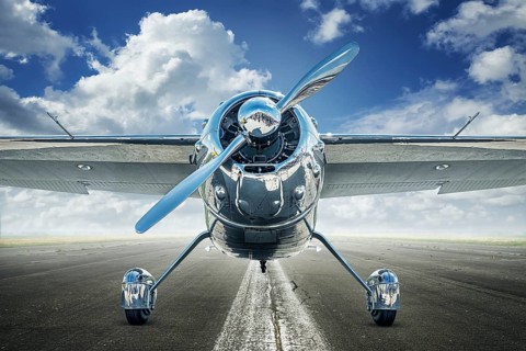 historical airplane on a runway is waiting for take off