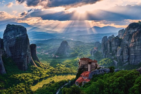Sunset view over nunnery of Moni Agias Varvaras Roussanou and beautiful massive rocky pillars of