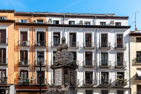 Madrid, Spain, November 1, 2020: Old residential building with iron balconies in the downtown of