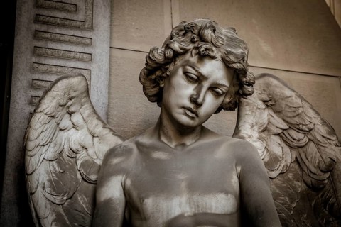 GENOA, ITALY, June 2020: antique statue of angel (beginning 1900, marble) in a Christian Catholic