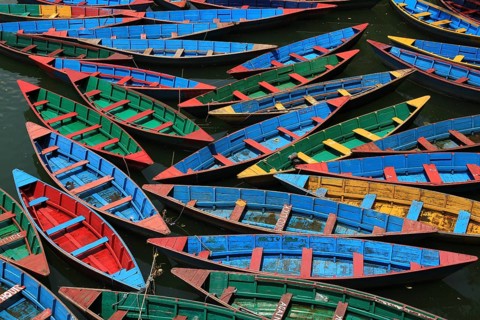 Multi colored rowing boats on Fewa lake, Pokhara
