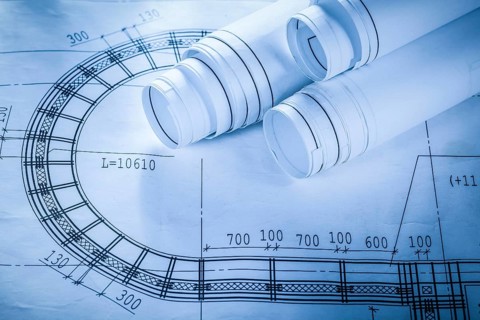 Rolled construction drawings on blueprint