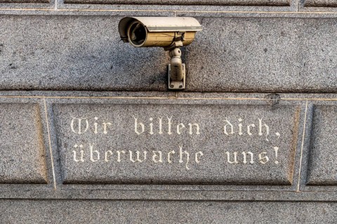Surveillance camera on a building, symbol for surveillance, internal security, control, data