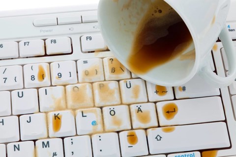 Cup of coffee spilled on a computer keyboard. Damage for insurance, Cup of coffee spilled on a