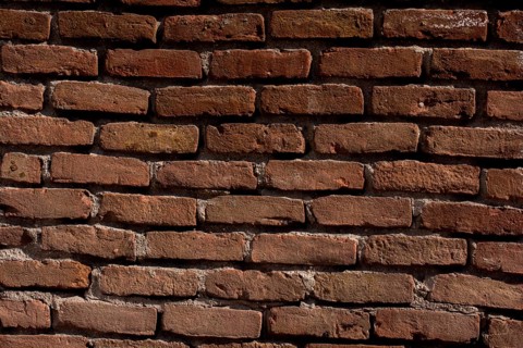 Old vintage grunge brick wall background texture with place for text