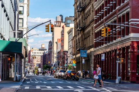 New York City, USA, June 25, 2018: Street with luxury fashion retail stores in Soho Cast Iron