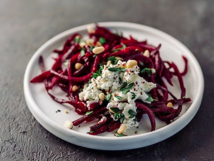 Raw beetroot spaghetti salad with soft cheese, nuts, thyme. Vegetable noodles - Fresh Beetroot