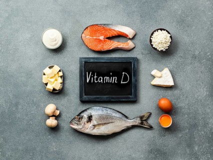 Vaitamin D sources concept. Fish, salmon, dairy products, eggs, mushrooms and chalkboard with