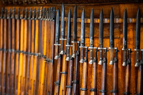 Old wood riffles with bayonets on them