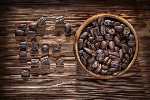 Coffee crops bowl on vintage wooden board