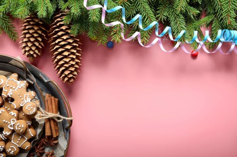 Flat lay design of Christmas greeting card of fir twigs cones party streamer and vintage metal tray
