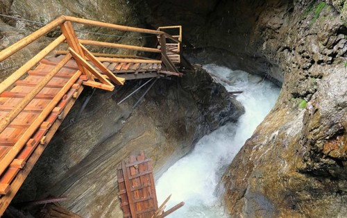 Steep stairs along waterfall and rocks in austria ragaslucht