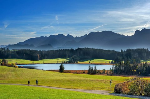 Autumnal Attlesee with Allgäu foothills and walks near Nesselwang, Allgäu, Bavaria, Germany