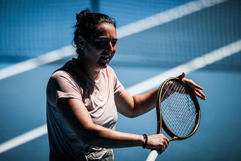 MELBOURNE, AUSTRALIA, JANUARY 12: Ons Jabeur of Tunisia practices with Naomi Osaka of Japan ahead