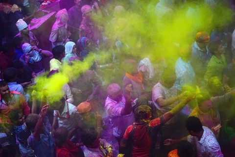 People throwing colored powder of Banke Bihari Temple, Uttar Pradesh, India, Asia