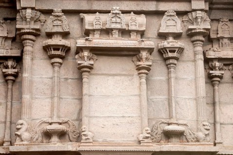 Richly relief stone carved pillars and mandapam on the wall of south gopuram of Shree Meenakshi