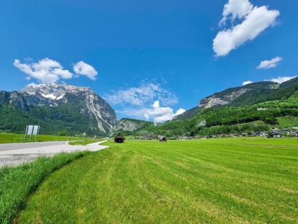 Summer austrian landscape with green meadows and Grimming mountain (2.351 m), an isolated peak in