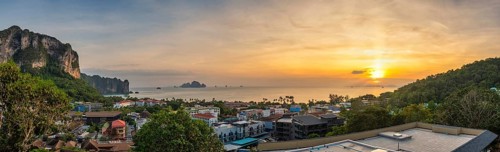 Tropical sea sunset at Ao Nang Beach with limestone mountain, Krabi Thailand high angle view nature
