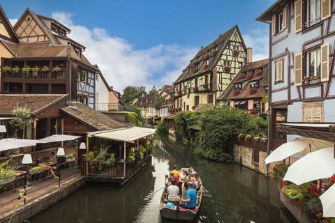 Little Venice (La Petite Venise), tourists enjoying a boat trip on the canal, Colmar, Alsace, Grand