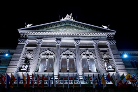 Beautiful Bundeshaus Illuminated Parliament Building or Federal Palace with Canton Flags at Night