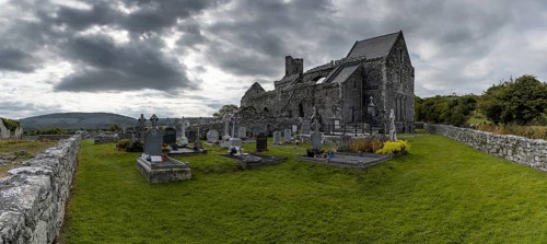 Ballyvaughan, Ireland, 28 July, 2022: panorama view of the historic 13th-century Corcomroe Abbey