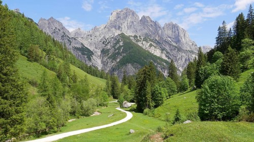 Dyllic hiking trail in the Klausbach valley near Ramsau (near Berchtesgaden) with a view of the