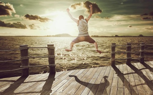 Cliff Jumping into the Ocean at Sunset, Summer Fun Lifestyle