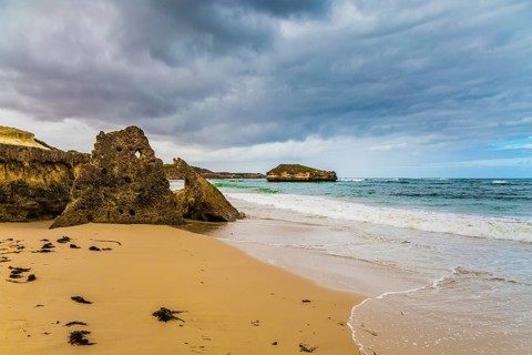 Picturesque seashore, coastal cliffs and a powerful surf of the Pacific Ocean. The Great Ocean Road