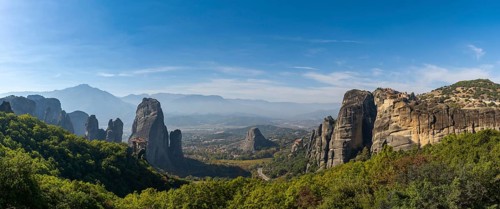 Panorama landscape view of the Meteora rock formations with the Saint Nikolaos monastery