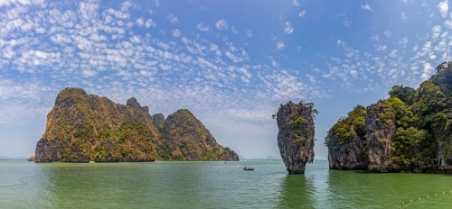 A colorful picture of the beautiful landscape of the James Bond Island and its iconic islet