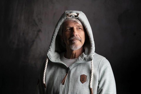 Elderly man with hoodie and hood on his head