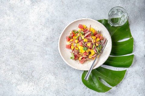 Food, Food, Tropical Hawaiian tahitian tuna mango salad on white plate on tropical monstera leafe
